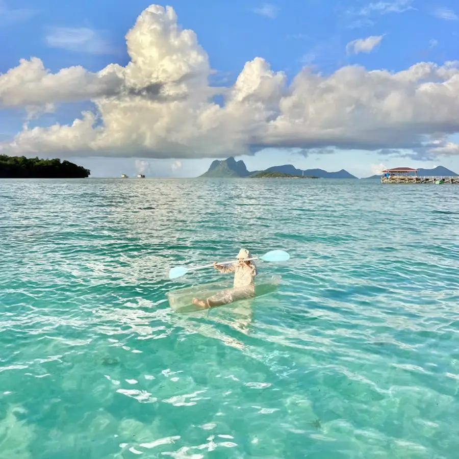 Lifestyle photography of a guest at the overwater resort Seaweed Village