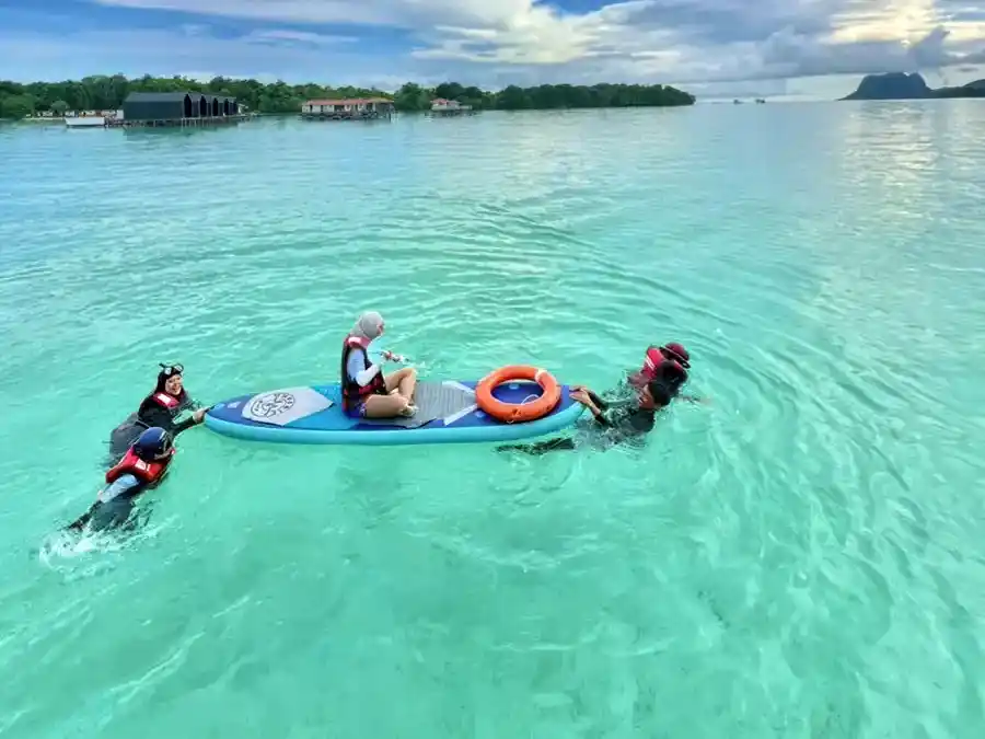 Recreational paddle boat activity for resort guests Seaweed Village